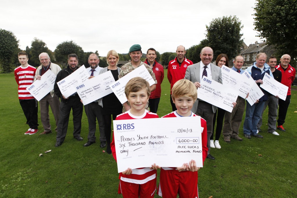 Representatives of local charities with presentation cheques