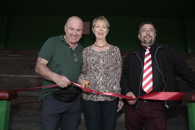 Cutting the ribbon to the renamed stand