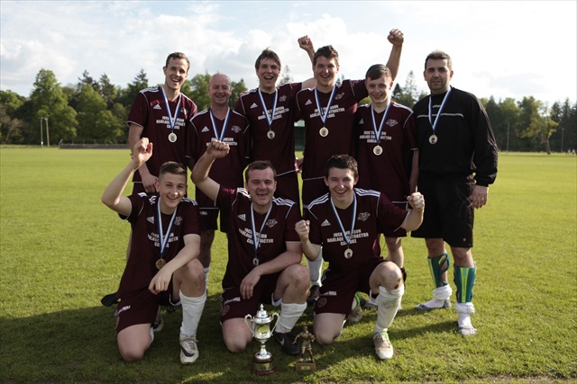 Carluke Hearts football team in burgandy strips, with medals