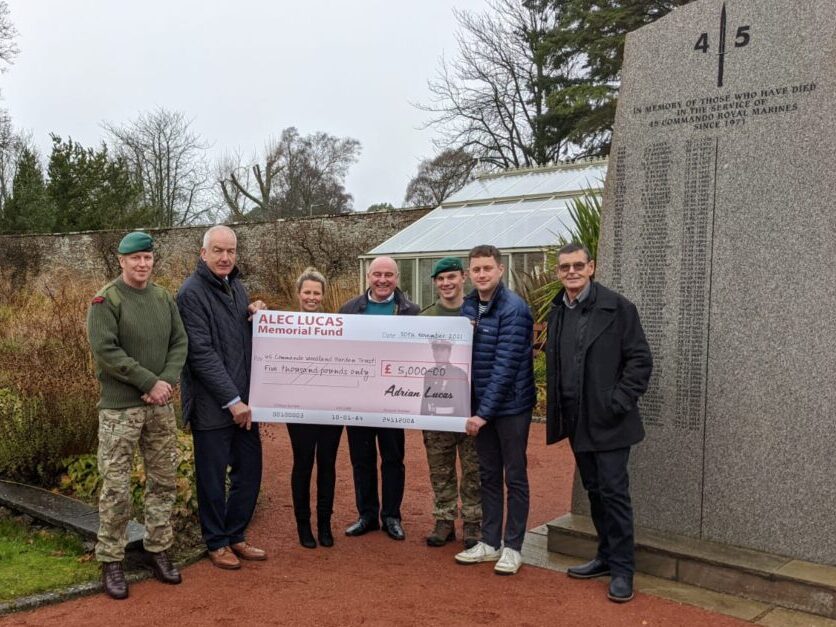 Adrian Lucas presenting funds to Royal Marines charities, November 2021